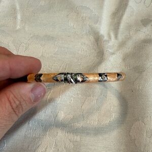 Carved Peach-Tone Bangle Bracelet with Silver Accents